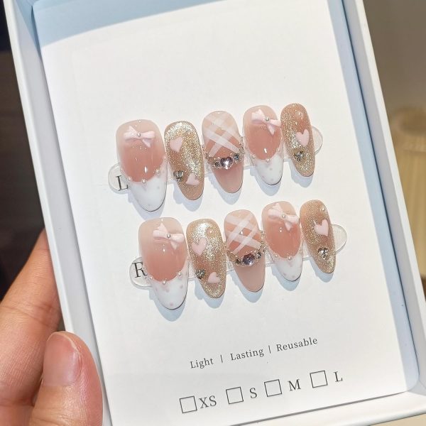 <p><strong>Glamorous Medium Reusable Almond Press-On Nails: Pink Cat Eye Glitter with Polka Dot French Tips, Hand-Painted Hearts & 3D Bow Rhinestones – Complete Princess K-Beauty Manicure Kit (Size S)</strong></p> - Image 4